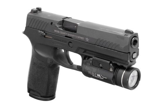 Police trade in full-size 9mm pistol with weapon light.